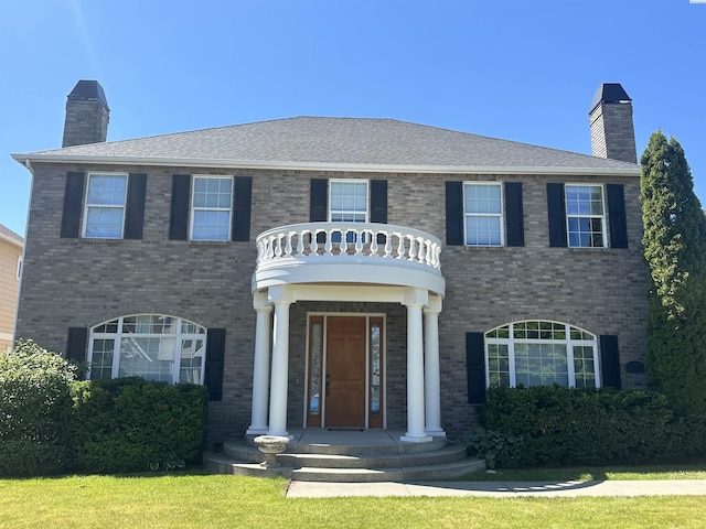 1105 SW Meyer Dr, Pullman, WA 99163 - colonial-style house with a chimney and brick siding