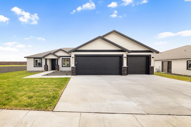 view of front of house with a garage, driveway, stone siding, a front lawn, and stucco siding