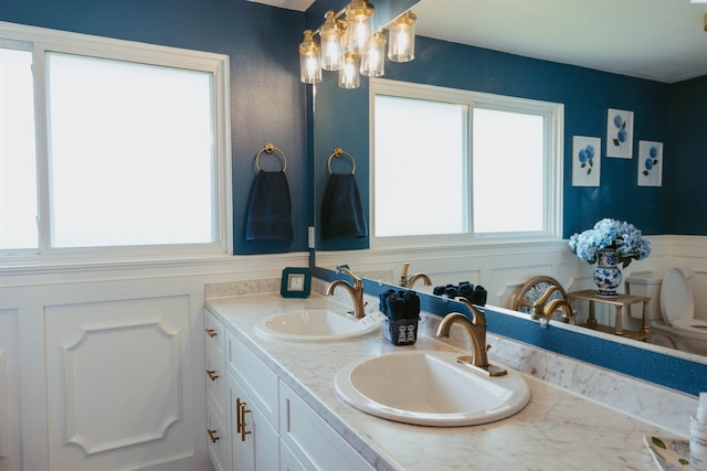 bathroom with vanity and a wealth of natural light