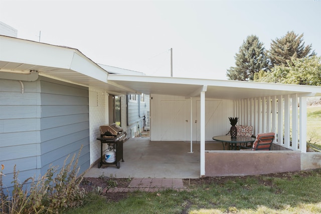 view of patio featuring grilling area and a carport