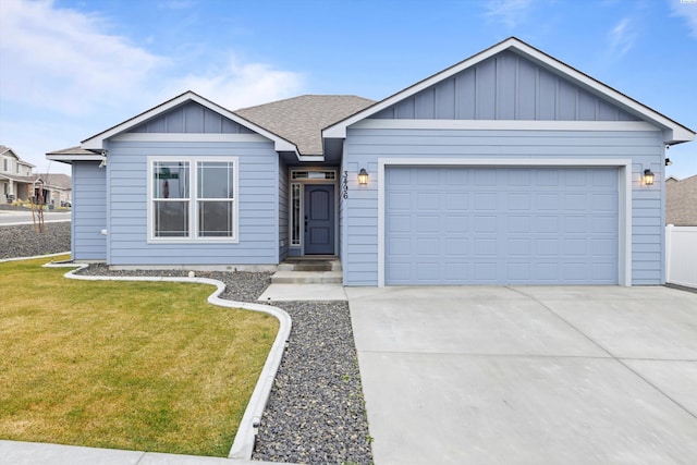 view of front of home featuring a garage and a front lawn