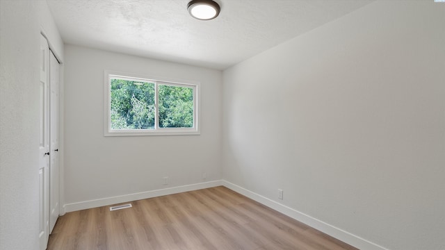 4308 S Sharron Ct, Kennewick, WA 99337 - unfurnished bedroom with light wood-style flooring and a closet