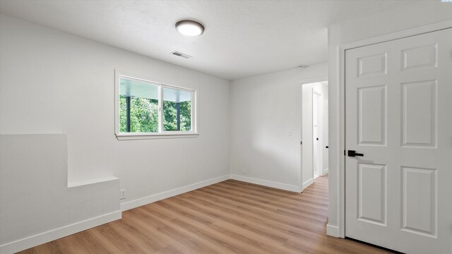 4308 S Sharron Ct, Kennewick, WA 99337 - unfurnished room with baseboards and light wood-style flooring