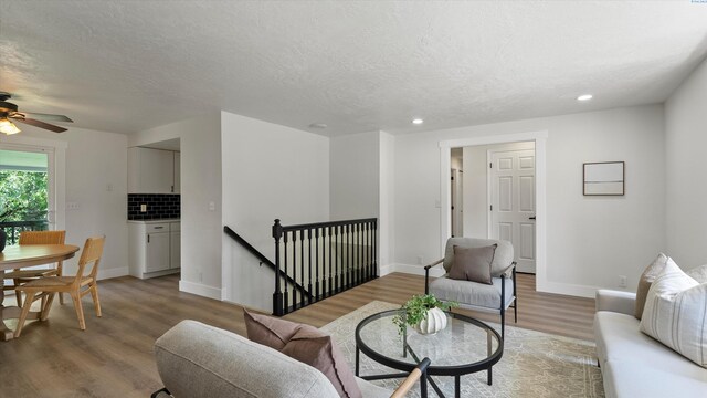 4308 S Sharron Ct, Kennewick, WA 99337 - living room featuring light wood finished floors, recessed lighting, a textured ceiling, and a ceiling fan