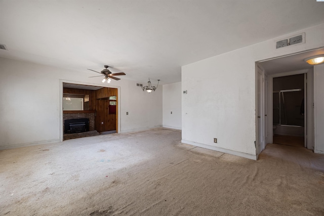 2018 W 2nd Ave, Kennewick, WA 99301 - unfurnished living room with ceiling fan, carpet floors, and a fireplace