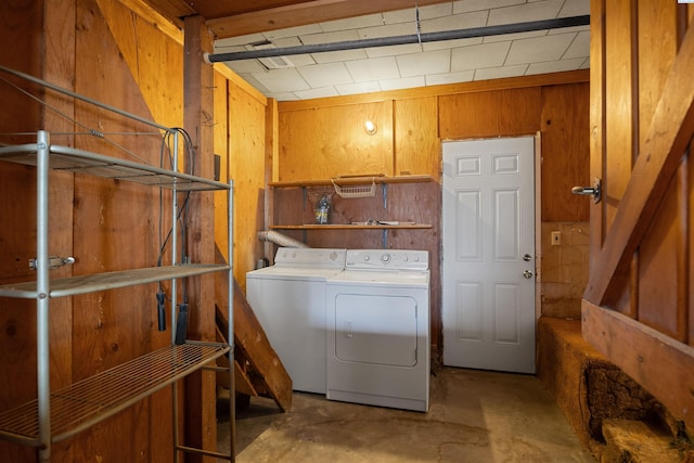 2018 W 2nd Ave, Kennewick, WA 99301 - washroom with washing machine and clothes dryer and wood walls