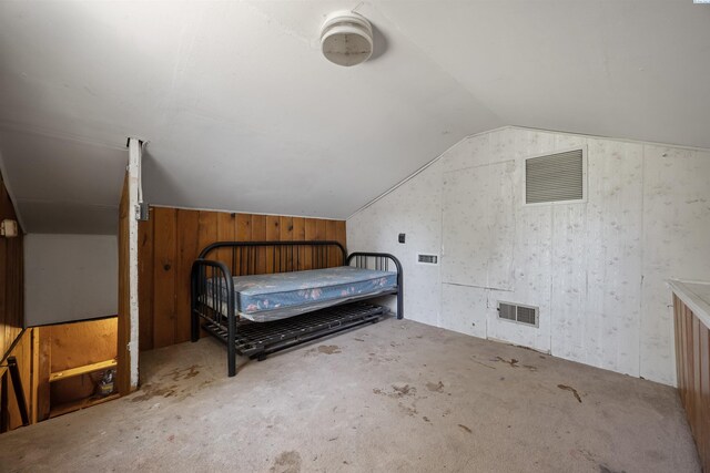 2018 W 2nd Ave, Kennewick, WA 99301 - carpeted bedroom featuring vaulted ceiling and wooden walls