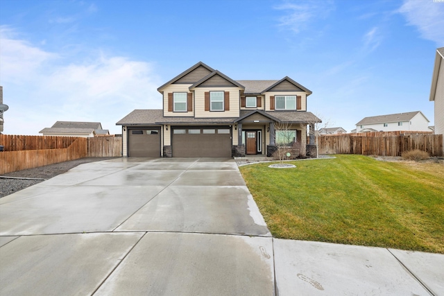 craftsman-style house featuring a garage and a front yard