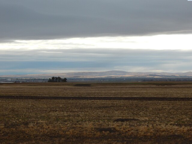 view of mountain feature with a rural view