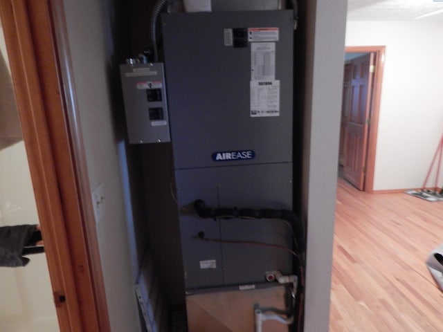 utility room with heating unit