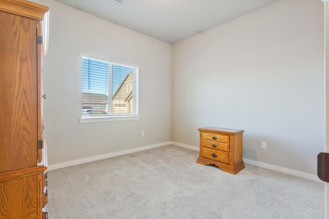 bedroom with baseboards and carpet floors