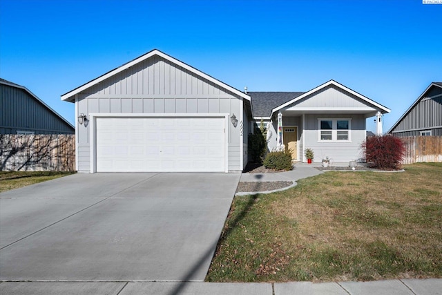 ranch-style home featuring a garage and a front lawn