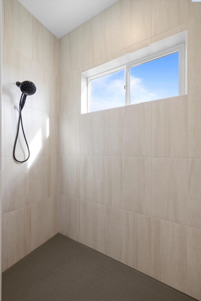 bathroom with tiled shower