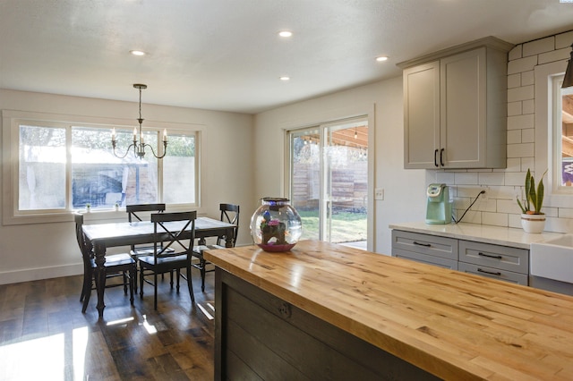 705 W 26th Ave, Kennewick, WA 99337 - kitchen with wooden counters, dark wood-style flooring, a chandelier, tasteful backsplash, and recessed lighting