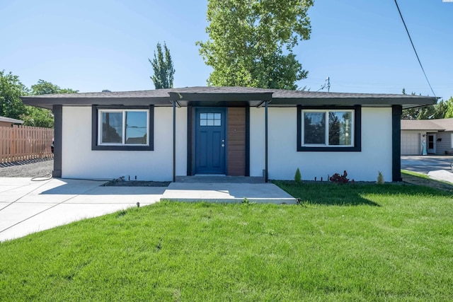 ranch-style house with a front lawn