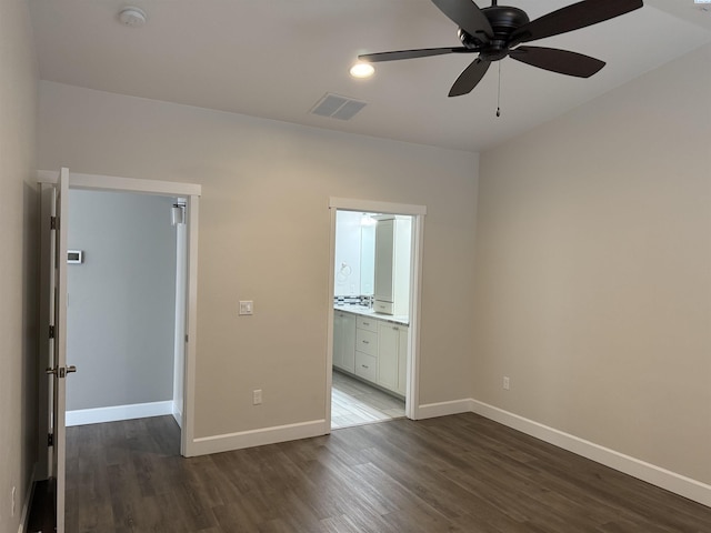 2730 Westhaven Ct, West Richland, WA 99353 - unfurnished bedroom with visible vents, baseboards, ensuite bath, and dark wood finished floors