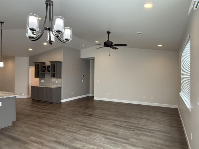 2730 Westhaven Ct, West Richland, WA 99353 - unfurnished living room with vaulted ceiling, recessed lighting, dark wood-style flooring, and baseboards
