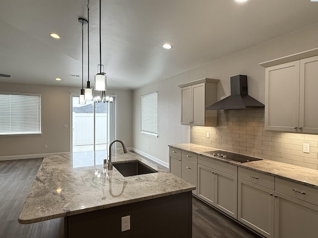 2730 Westhaven Ct, West Richland, WA 99353 - kitchen with tasteful backsplash, dark wood-type flooring, black electric stovetop, wall chimney exhaust hood, and a sink