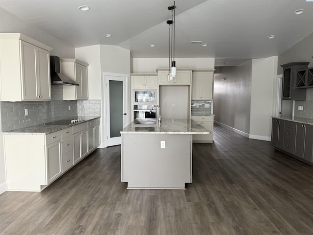 2730 Westhaven Ct, West Richland, WA 99353 - kitchen featuring black electric stovetop, dark wood-type flooring, wall chimney range hood, and light stone countertops
