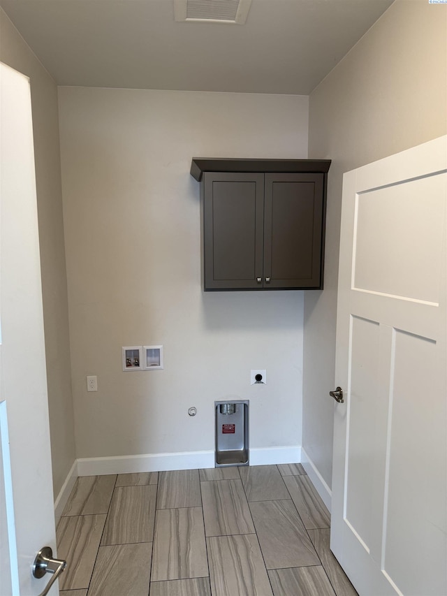 2730 Westhaven Ct, West Richland, WA 99353 - clothes washing area featuring baseboards, washer hookup, hookup for a gas dryer, cabinet space, and electric dryer hookup