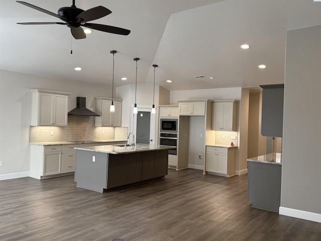 2730 Westhaven Ct, West Richland, WA 99353 - kitchen featuring a kitchen island with sink, dark wood finished floors, wall chimney exhaust hood, stainless steel oven, and built in microwave
