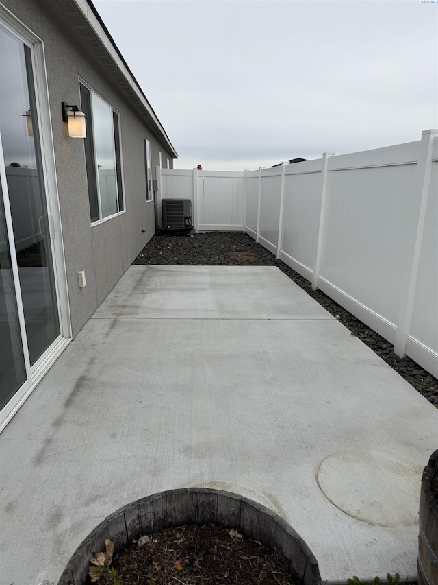 2730 Westhaven Ct, West Richland, WA 99353 - view of patio featuring central AC unit and a fenced backyard