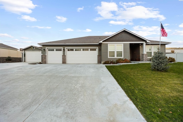 view of front of house with a garage and a front lawn