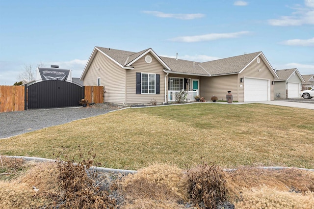 ranch-style house featuring a garage, covered porch, and a front lawn