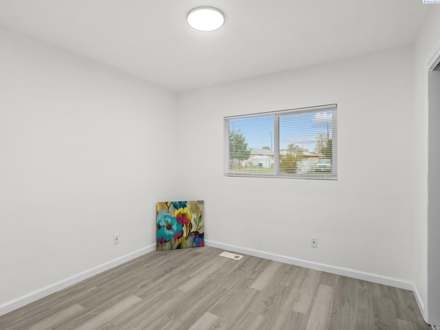 unfurnished room featuring light wood-type flooring