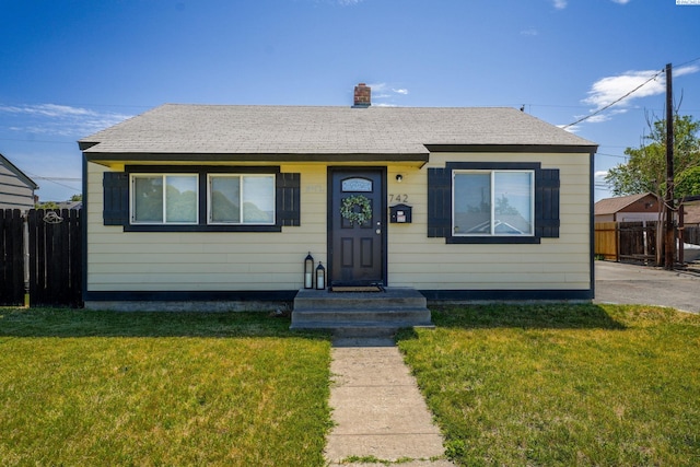 742 E 4th Ave, Kennewick, WA 99336 - bungalow-style house featuring a shingled roof and a chimney