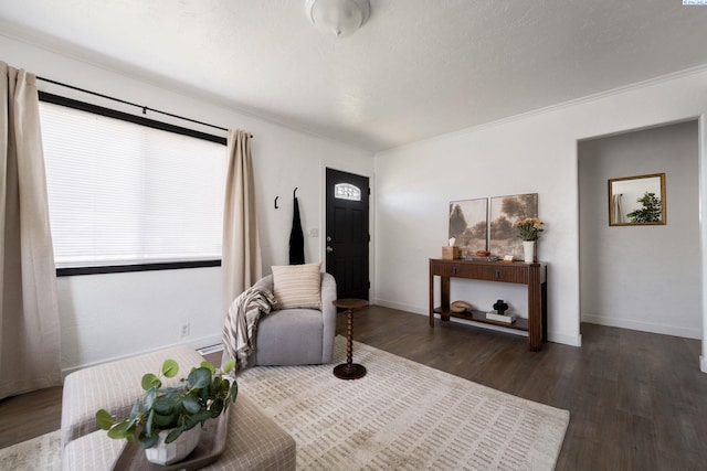742 E 4th Ave, Kennewick, WA 99336 - sitting room featuring dark wood-style floors, baseboards, and ornamental molding