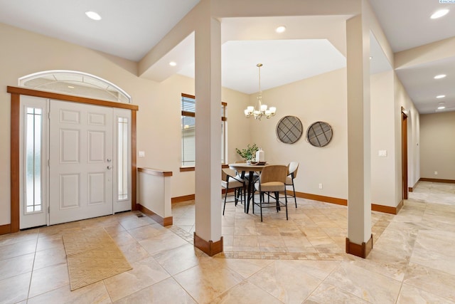 entryway with a notable chandelier and a wealth of natural light