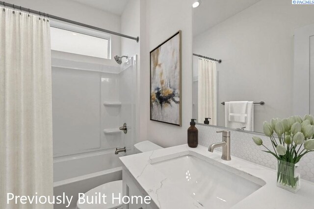 12113 Dunsmuir Dr, Pasco, WA 99301 - bathroom featuring shower / tub combo, toilet, and vanity