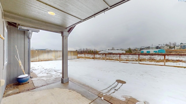 view of snow covered patio