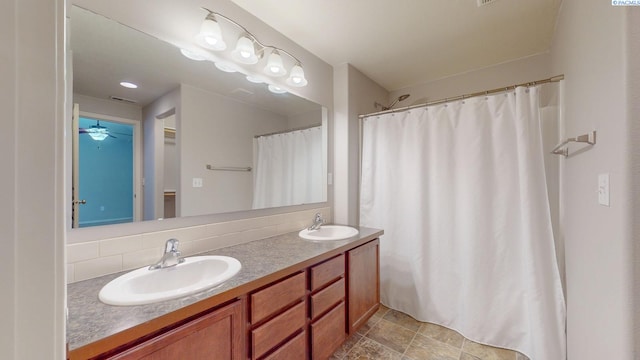 bathroom featuring backsplash and vanity