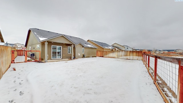 view of snow covered house