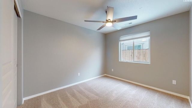 unfurnished room with light carpet and ceiling fan