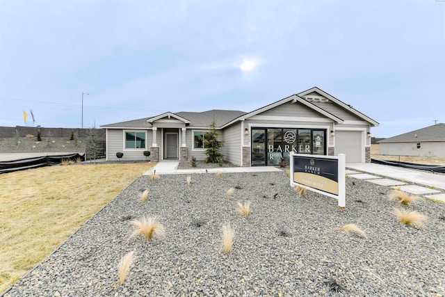 view of front facade with a garage and a front yard