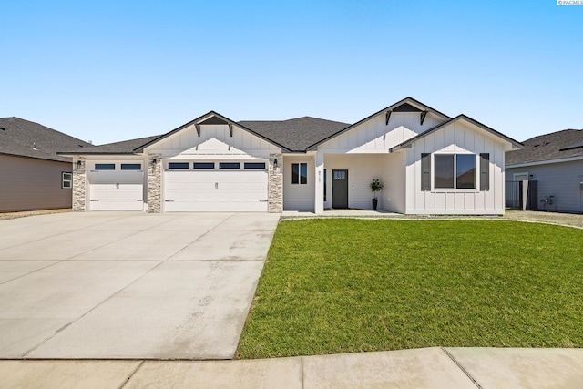 8717 Ashen Dr, Pasco, WA 99301 - modern farmhouse style home featuring board and batten siding, an attached garage, a front yard, and concrete driveway
