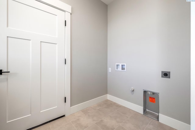 8717 Ashen Dr, Pasco, WA 99301 - washroom featuring hookup for a washing machine, baseboards, electric dryer hookup, gas dryer hookup, and light tile patterned floors