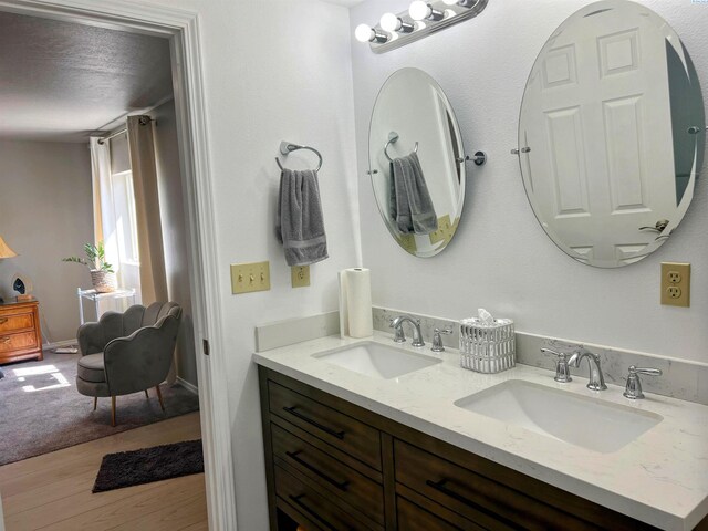 1836 W Park St, Pasco, WA 99301 - bathroom featuring double vanity and wood finished floors