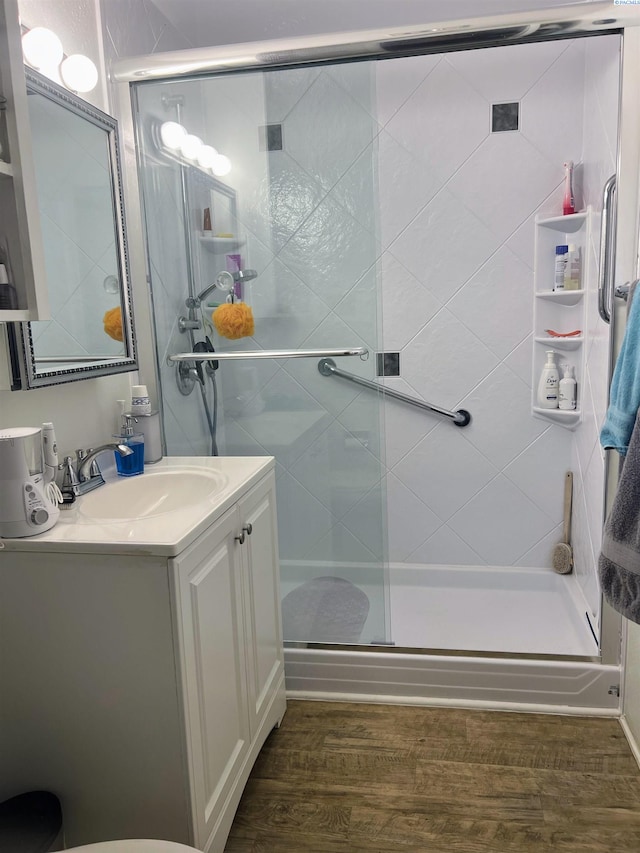 1836 W Park St, Pasco, WA 99301 - full bathroom with vanity, wood finished floors, and a stall shower