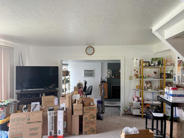 1836 W Park St, Pasco, WA 99301 - living room featuring carpet floors, a textured ceiling, and a wall mounted AC