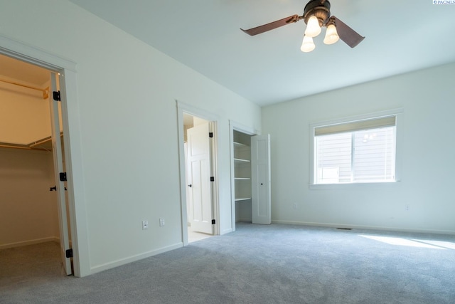 1205 SW Hannah St, Pullman, WA 99163 - unfurnished bedroom featuring carpet floors, a closet, baseboards, ceiling fan, and a spacious closet
