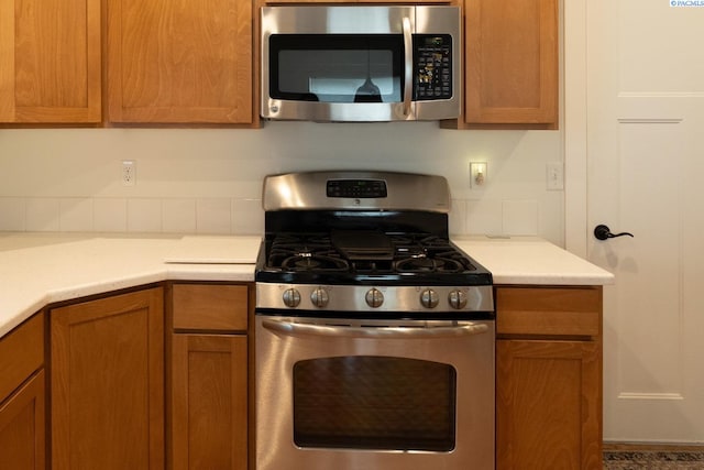 1205 SW Hannah St, Pullman, WA 99163 - kitchen featuring light countertops, brown cabinets, and stainless steel appliances