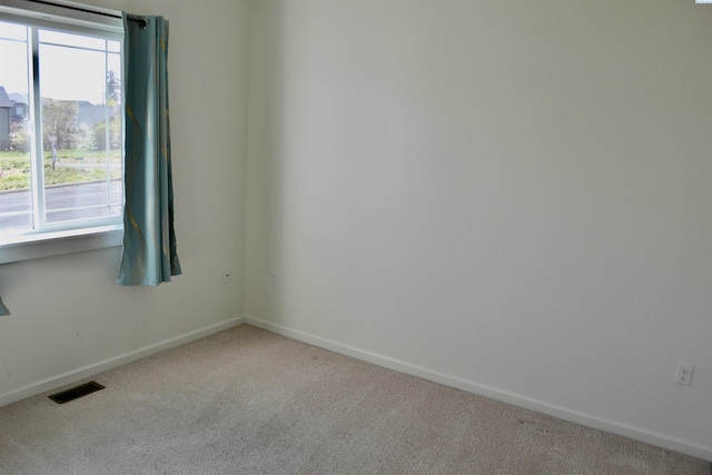 1205 SW Hannah St, Pullman, WA 99163 - carpeted empty room featuring a healthy amount of sunlight, baseboards, and visible vents