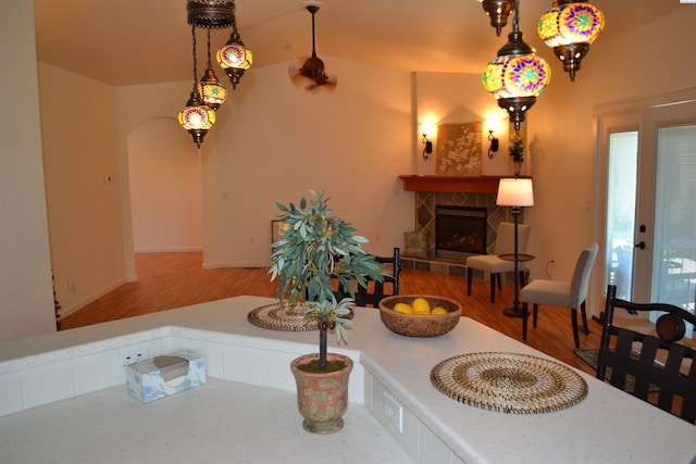 1205 SW Hannah St, Pullman, WA 99163 - dining room with arched walkways, a stone fireplace, and wood finished floors
