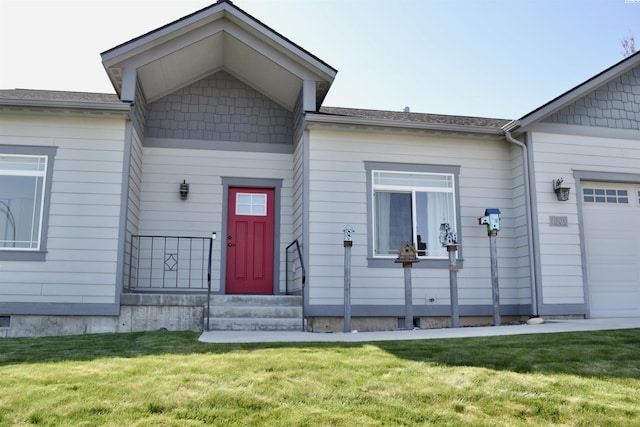 1205 SW Hannah St, Pullman, WA 99163 - view of front facade with a garage, entry steps, and a front yard