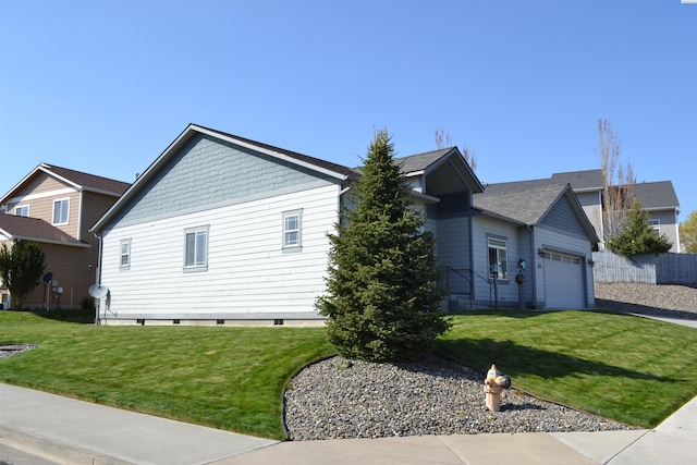 1205 SW Hannah St, Pullman, WA 99163 - view of property exterior with a yard, an attached garage, and fence