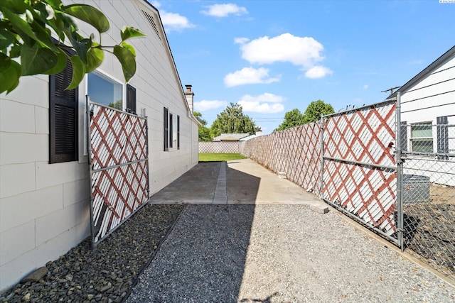 2008 Tinkle St, Richland, WA 99352 - view of side of home featuring a fenced backyard and a patio area